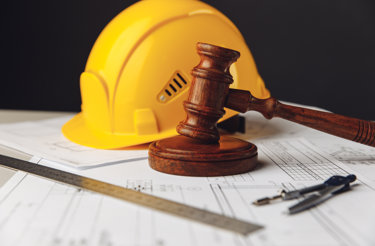 wooden-gavel-with-yellow-helmet