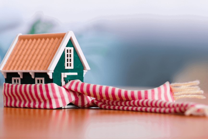A toy house with a scarf around it