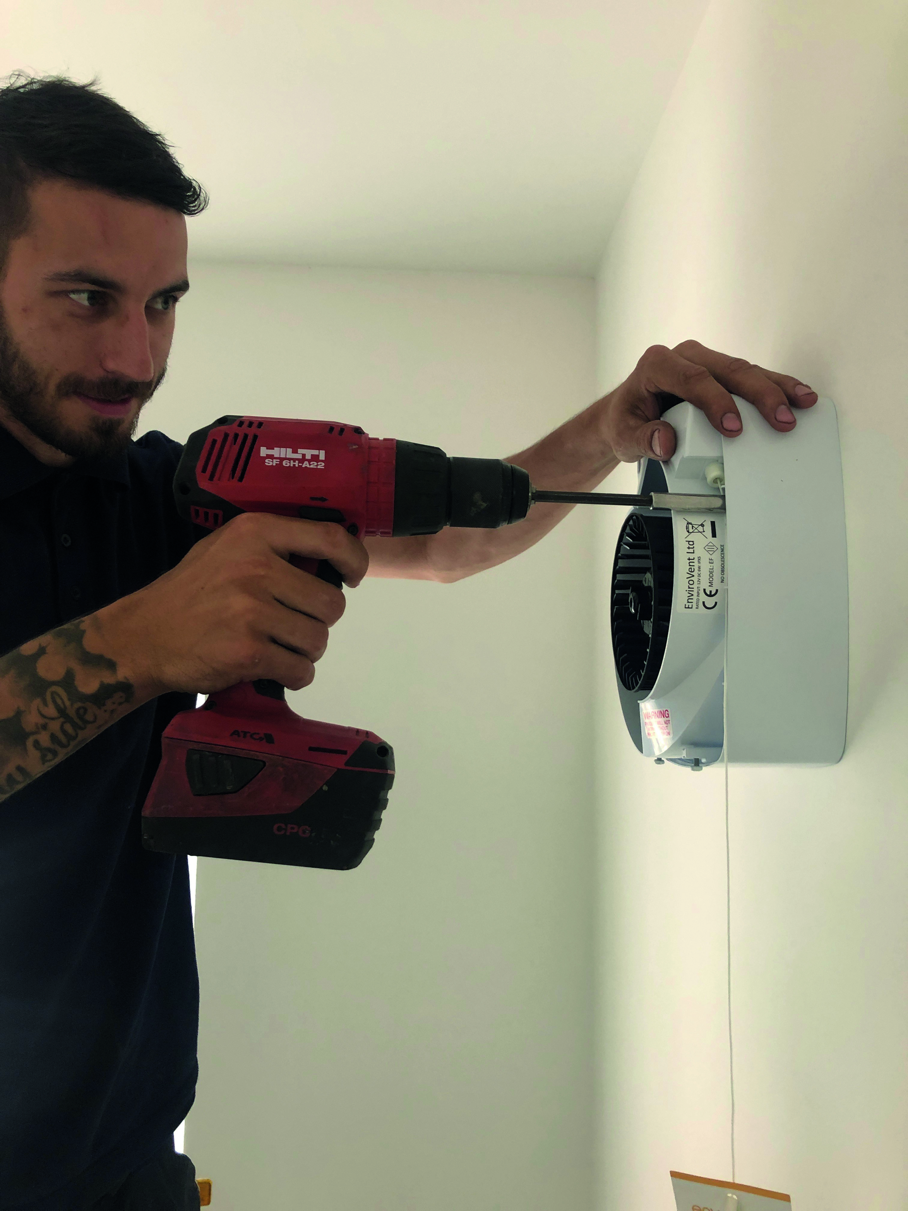 man-installing-envirovent-extractor-fan