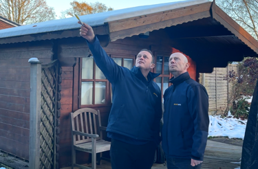 two-men-inspecting-exterior-property