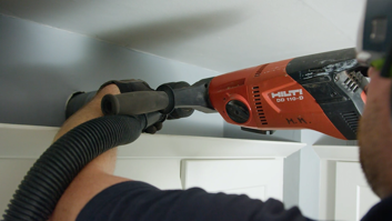 man-drilling-hole-in-wall