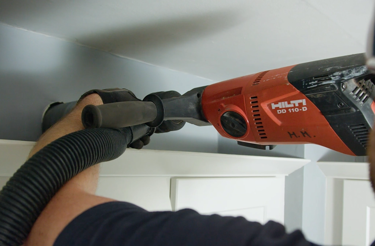 man-drilling-hole-in-wall