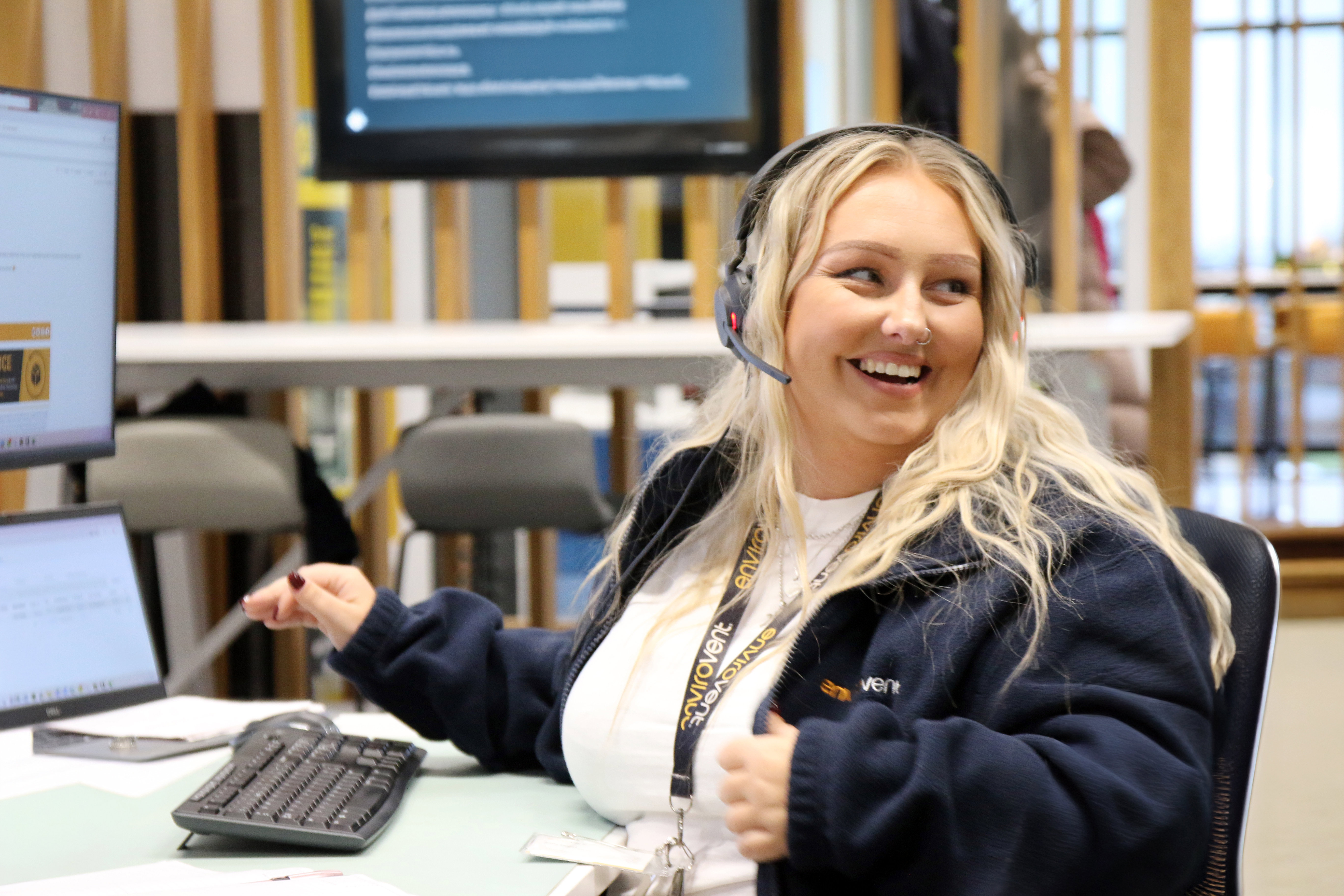 young-woman-laughing-working-customer-care