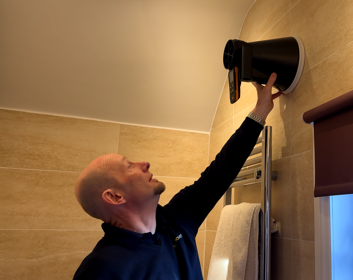 man-inspecting-bathroom-ventilation